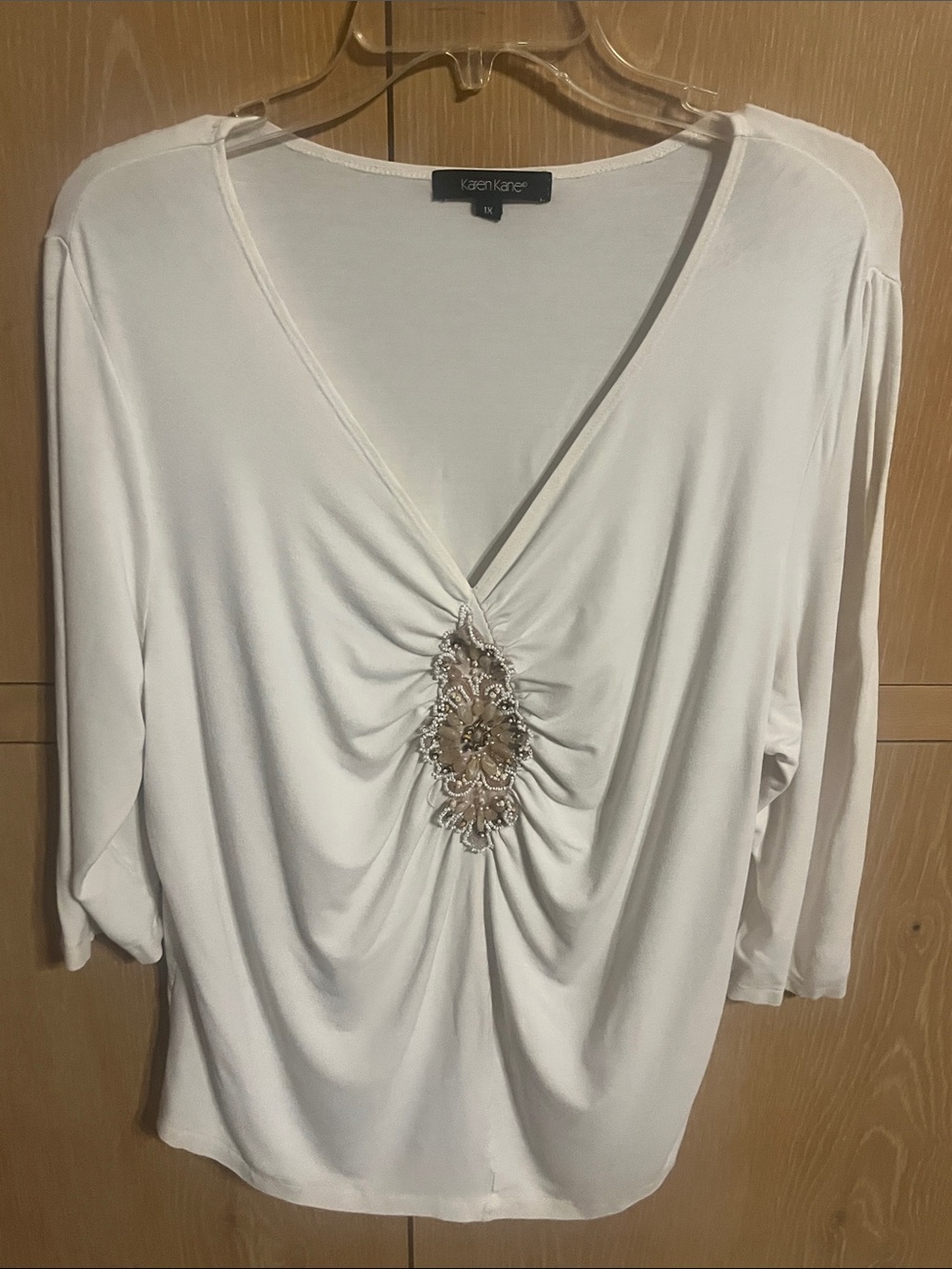 Karen Kane Ivory V-Neck Top with Center Jeweled Embellishment